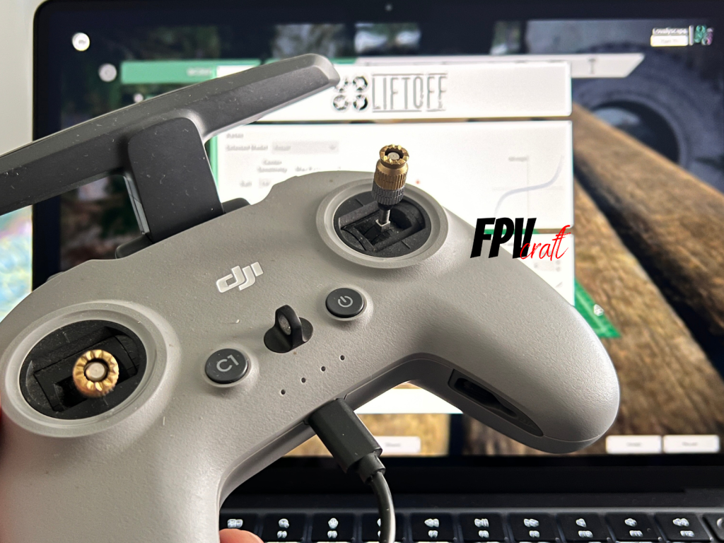 The DJI FPV Remote Controller 2 connected to a laptop ready to practice in an FPV Simulator (Liftoff)