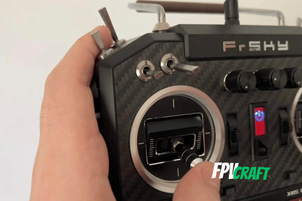 controlling the FrSky radio transmitter with thumbs, left side of controller photo capture