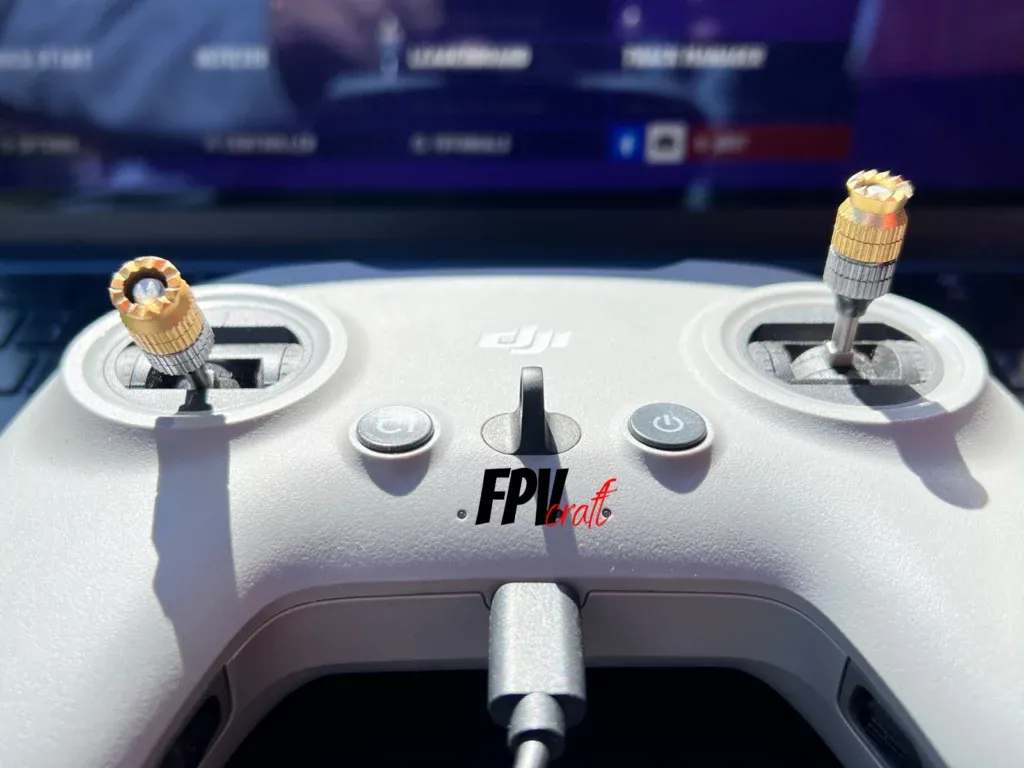 DJI FPV RC 2 closeup with VelociDrone in the background screen