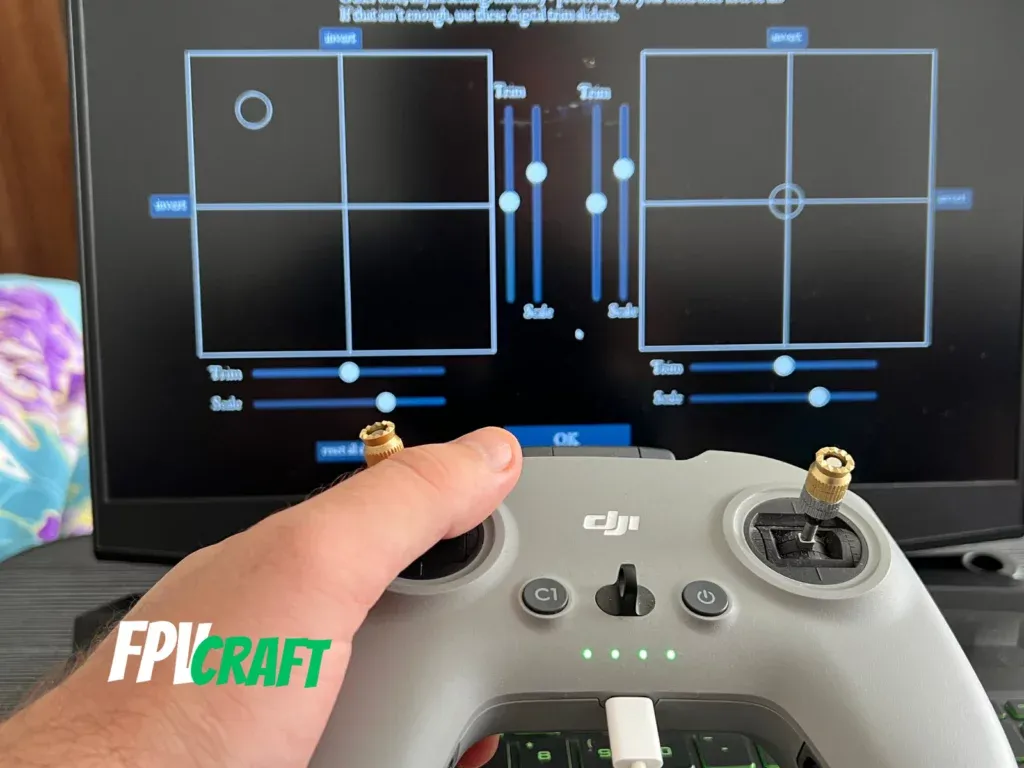dji fpv remote controller 2 in front of fpv freerider recharged simulator