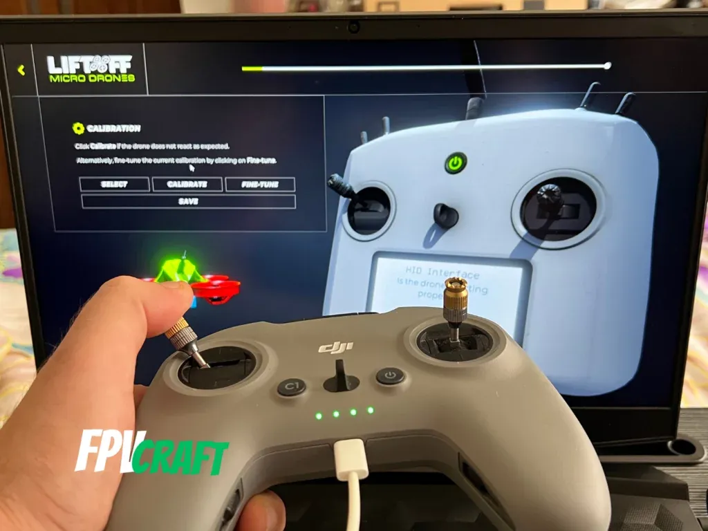 dji fpv remote controller 2 in front of liftoff micro drones