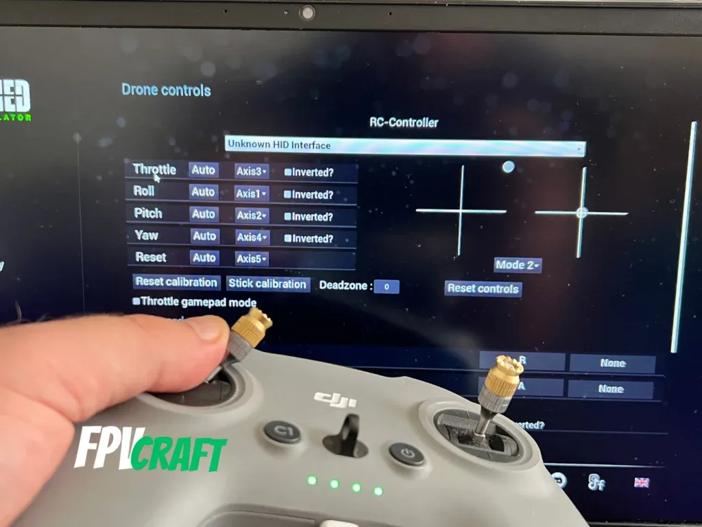 dji fpv remote controller 2 in front of uncrashed fpv